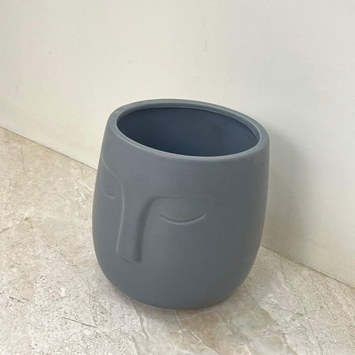 artistic face planter in modern gray finish