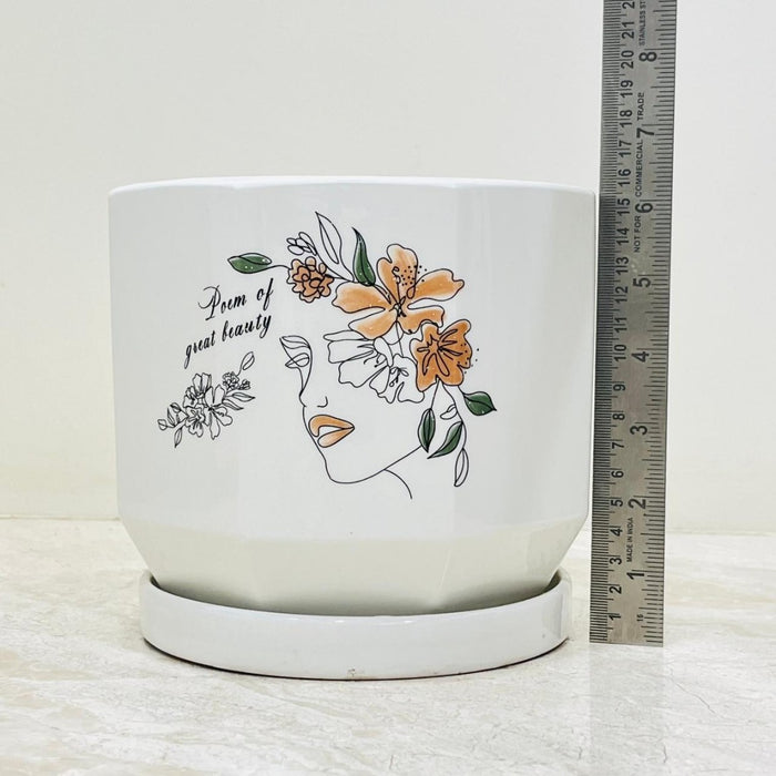 Modern ceramic pots featuring face and flower art