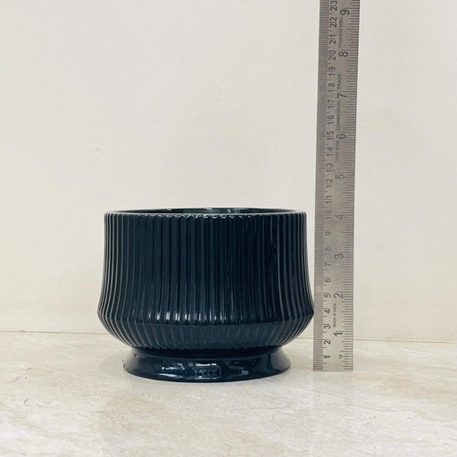 Modern black ceramic planter with ribbed texture