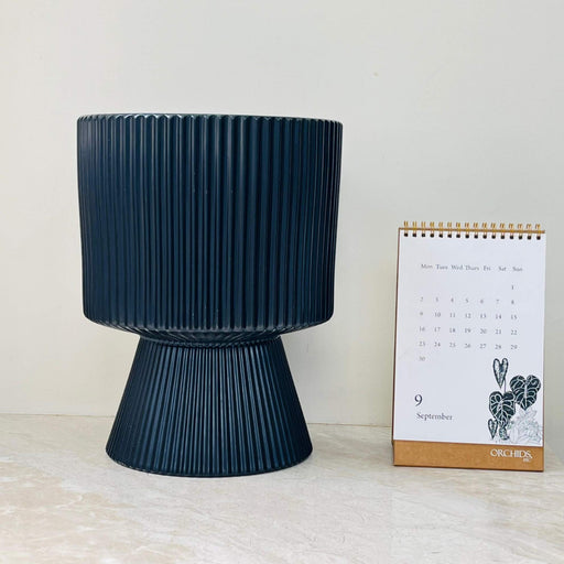 Black ribbed ceramic planter with flared base