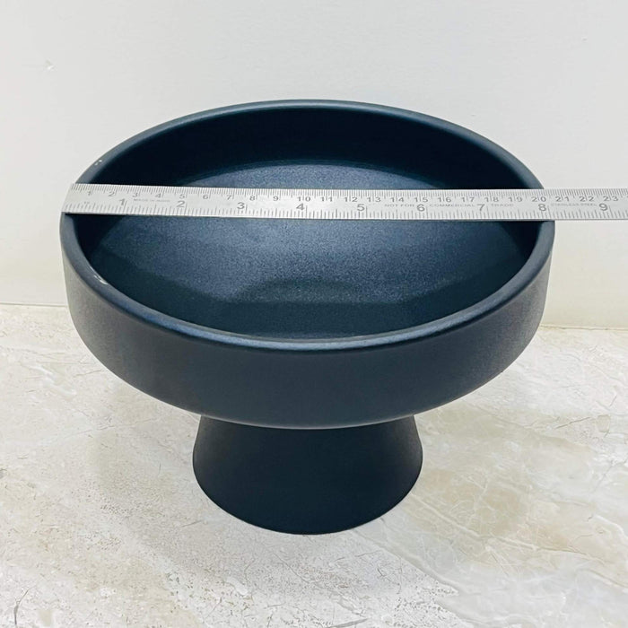 Bowl-shaped matte black ceramic pot for small plants