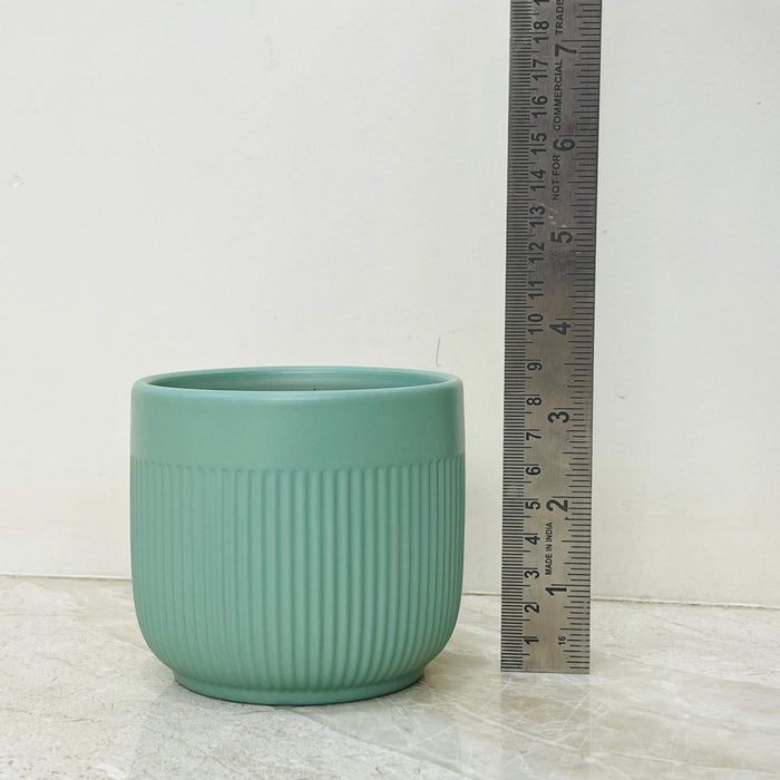 Decorative matte green ceramic plant pot for home decor