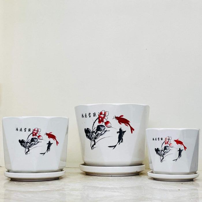 Decorative ceramic pots with koi fish and floral motifs in black and red