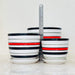 Trio of striped ceramic planters with red and black accents