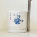 White ceramic pot set with hand-painted blue flowers