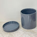 Dark grey ceramic planter with drainage saucer