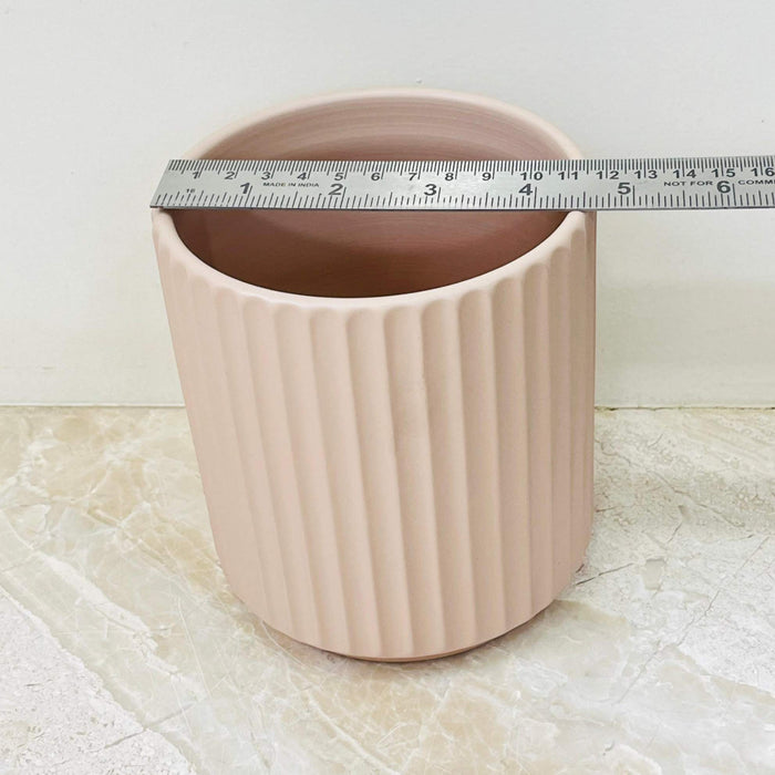 Small beige ribbed indoor ceramic planter