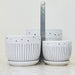 Decorative white ceramic planters with floral and stripe patterns