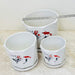 Trio of ceramic pots with red koi fish and floral accents