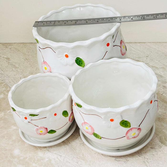 Set of ceramic planters with hand-painted pink flowers