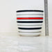 Decorative ceramic pots with red and black horizontal stripe design