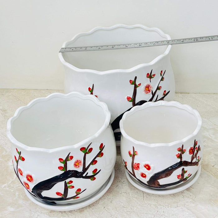 Scalloped rim ceramic planter with cherry blossom