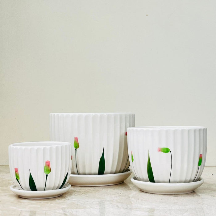 Elegant fluted ceramic pots with floral details