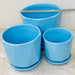 Modern blue ceramic planters with saucers