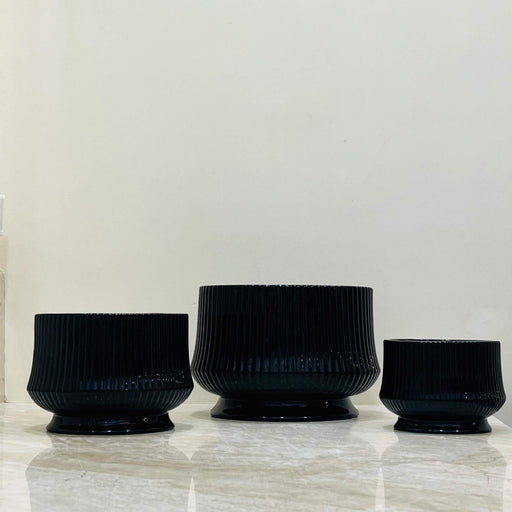 Glossy black ribbed ceramic planter