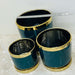 Green ceramic planters with gold accents