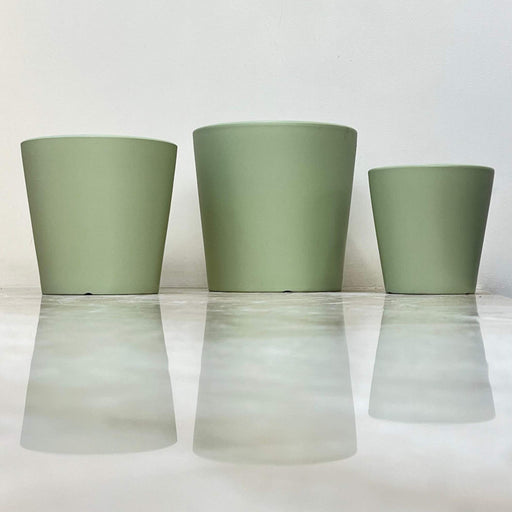 Set of green minimalist ceramic pots in three sizes