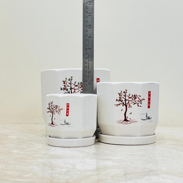 White ceramic pots with artistic tree and boat scene