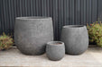 Set of three black ceramic pots with speckled texture