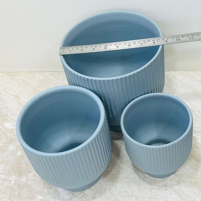 Large blue ribbed ceramic planter for indoor plants