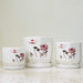 White ceramic pots with lotus and sunset design