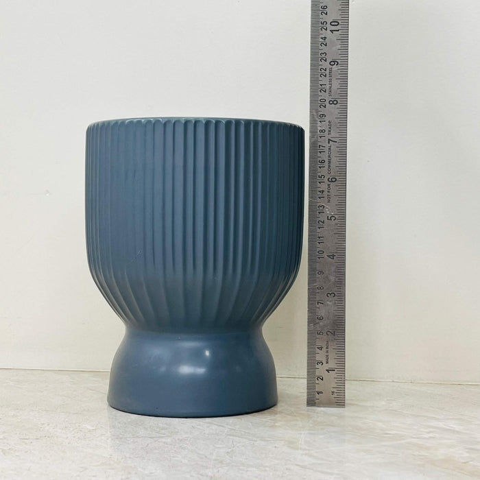 Matte grey ceramic planter with ribbed texture