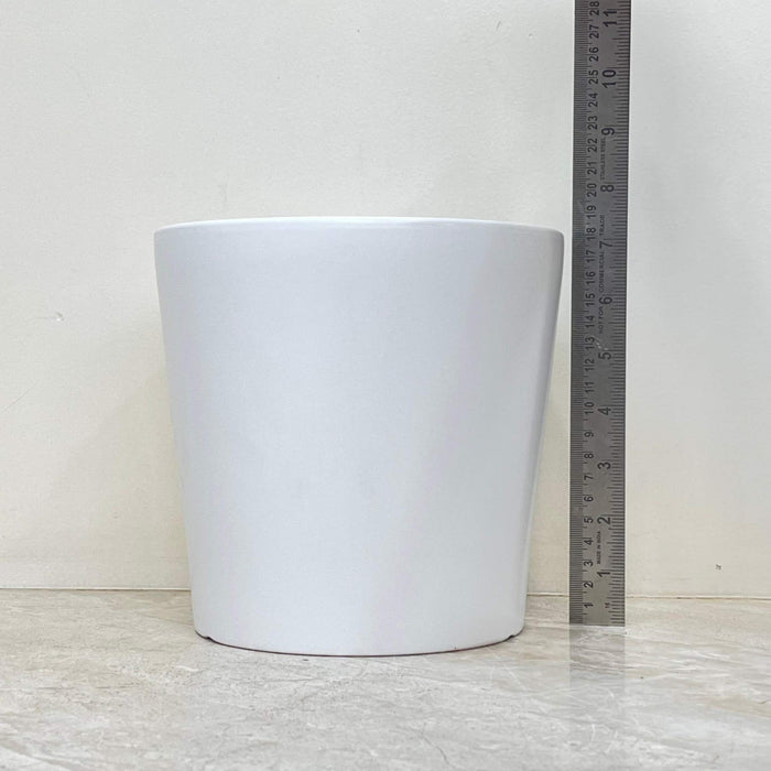 Three matte white ceramic pots for indoor plants