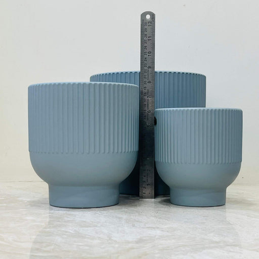 Medium ribbed ceramic plant pot in matte blue