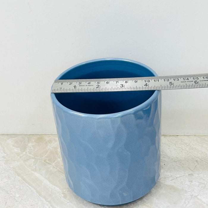 Medium blue ceramic planter with textured surface