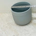 Minimalist gray ceramic pot with ribbed design