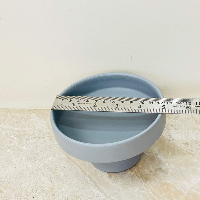 Small matte gray plant pot with raised pedestal design