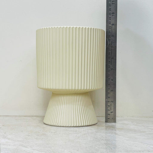 Minimalist ivory ceramic planter with pedestal base