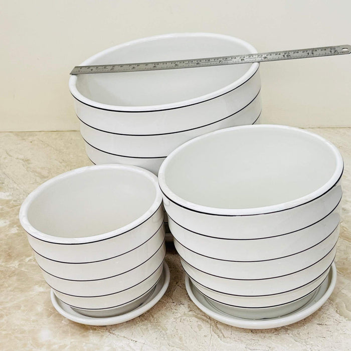 Set of ceramic pots with modern black-lined pattern