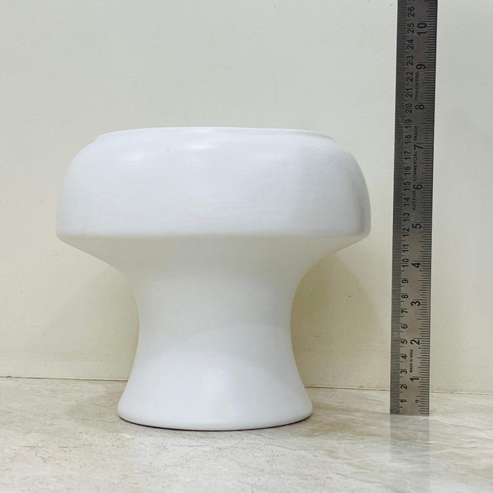 Minimalist white ceramic plant pot with hourglass shape