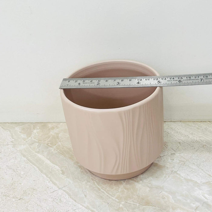 Textured pink ceramic planter for medium indoor plants