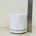 Geometric white planter with base for modern home décor.