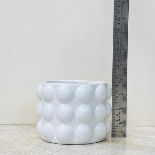 Modern round ceramic planter with spherical design