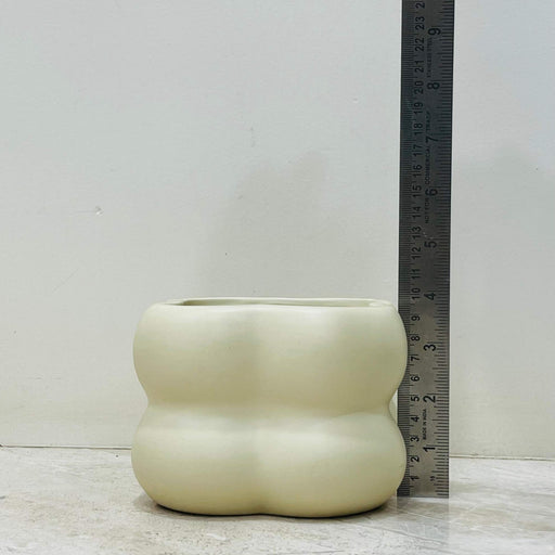 Matte cream-colored ceramic pot for indoor plants