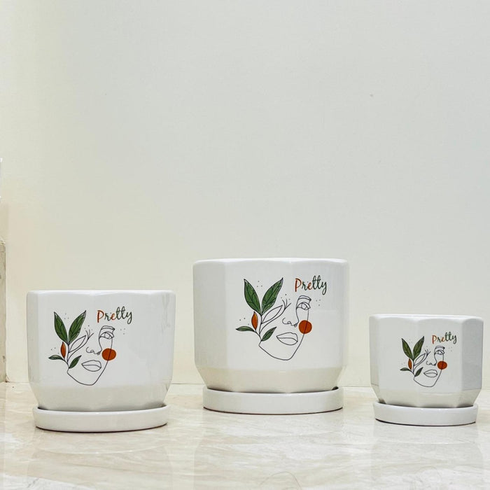 Pretty Face modern ceramic planter set with line art design