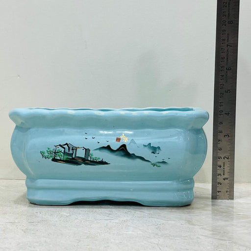 Rectangular ceramic pot with scenic design