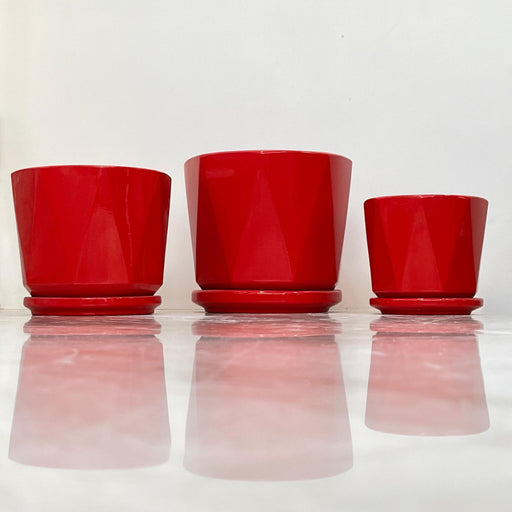 Red ceramic planter set with modern geometric design