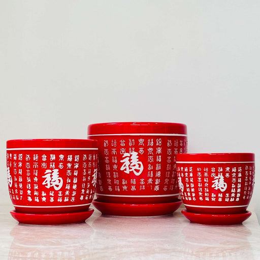 Red ceramic planter set with Chinese calligraphy