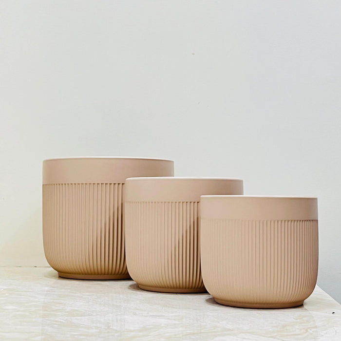 Neutral tone ribbed ceramic planters