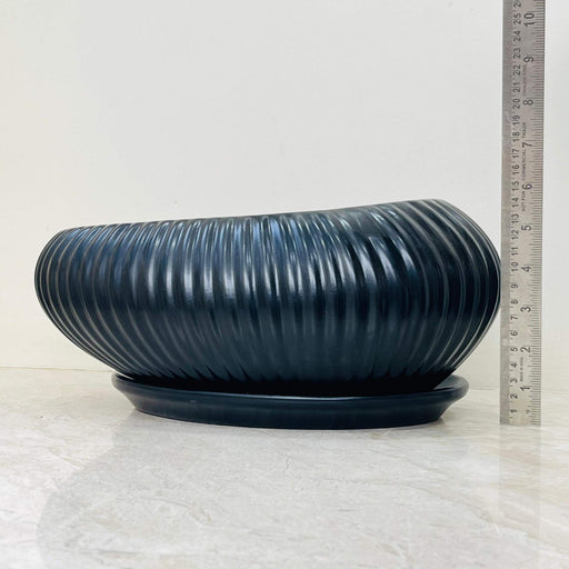 Matte black ribbed ceramic plant pot