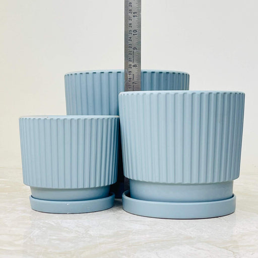 Matte blue ceramic pot set with a ribbed design