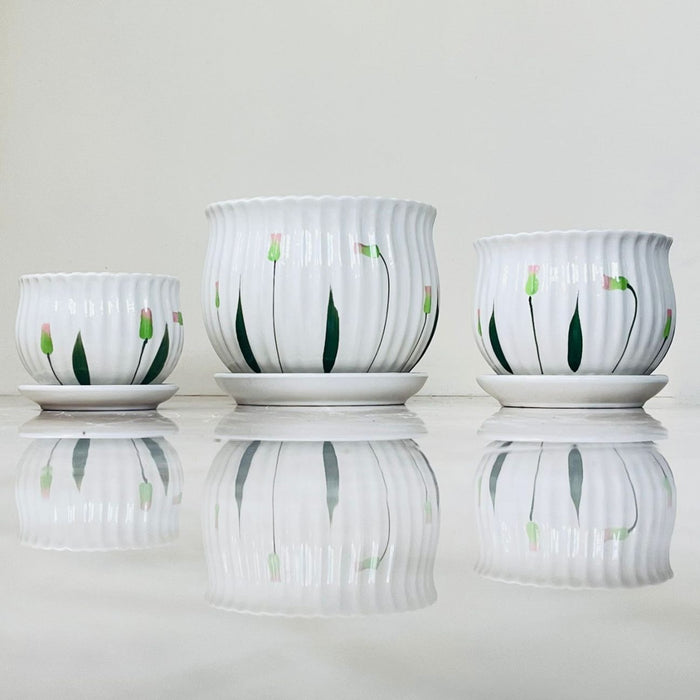 Elegant ceramic pots with hand-painted flowers