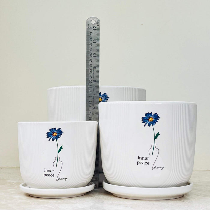 White ceramic pot set featuring 'Inner Peace' design