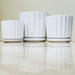 White ceramic pots for indoor plants with ribbed texture