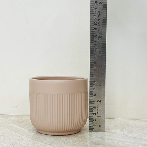 Sandy ribbed ceramic planter for modern decor