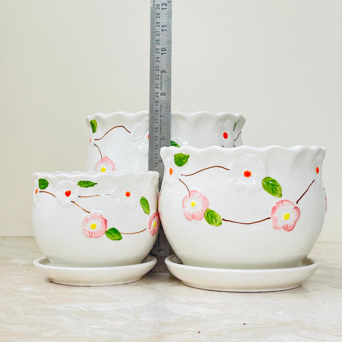 Set of ceramic planters with hand-painted pink flowers